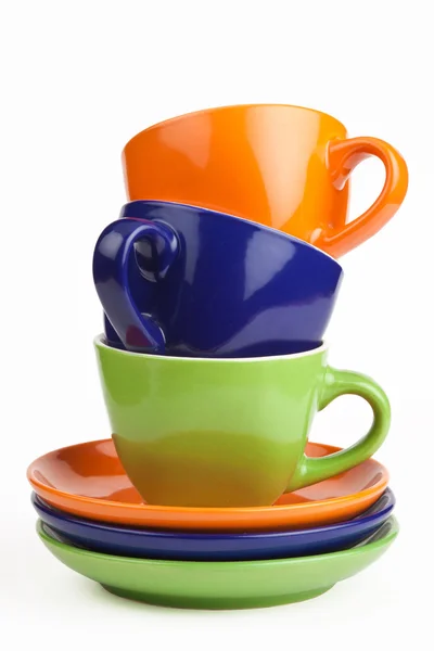 Çok renkli teacups ve uçan daireler — Stok fotoğraf