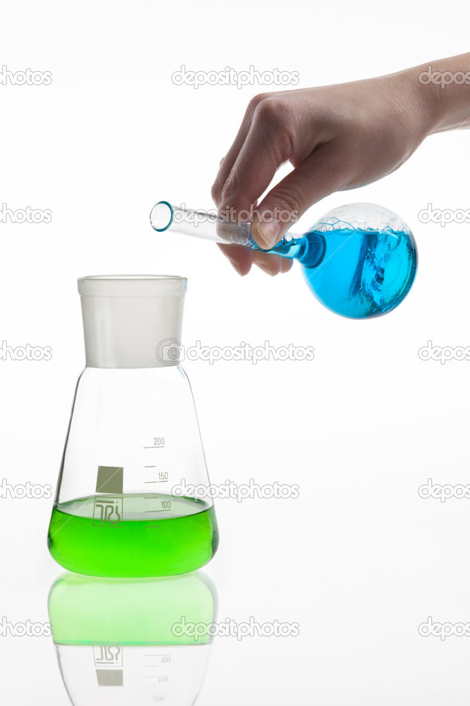 Lab worker mixing chemicals.