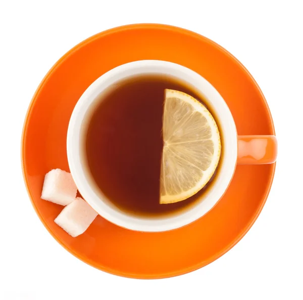 Turuncu çay fincanı şeker ve limon ile. — Stok fotoğraf