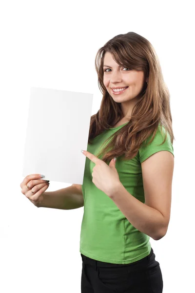 Young woman pointing at a white sign. — Stock Photo, Image