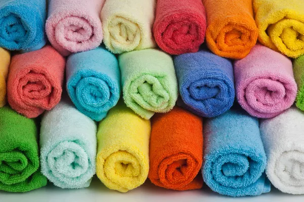 Set of colored towels on white. — Stock Photo, Image