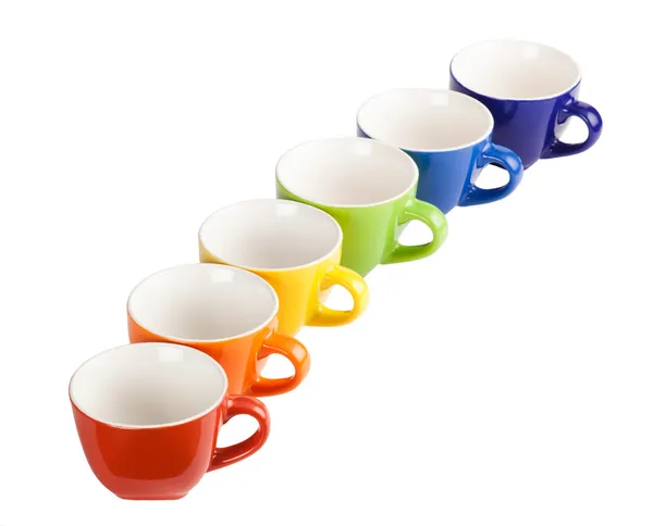 Colored tea cups and saucers. — Stock Photo, Image