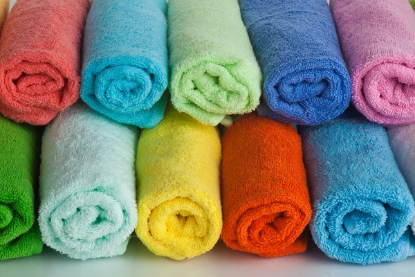 Set of colored towels on white. — Stock Photo, Image