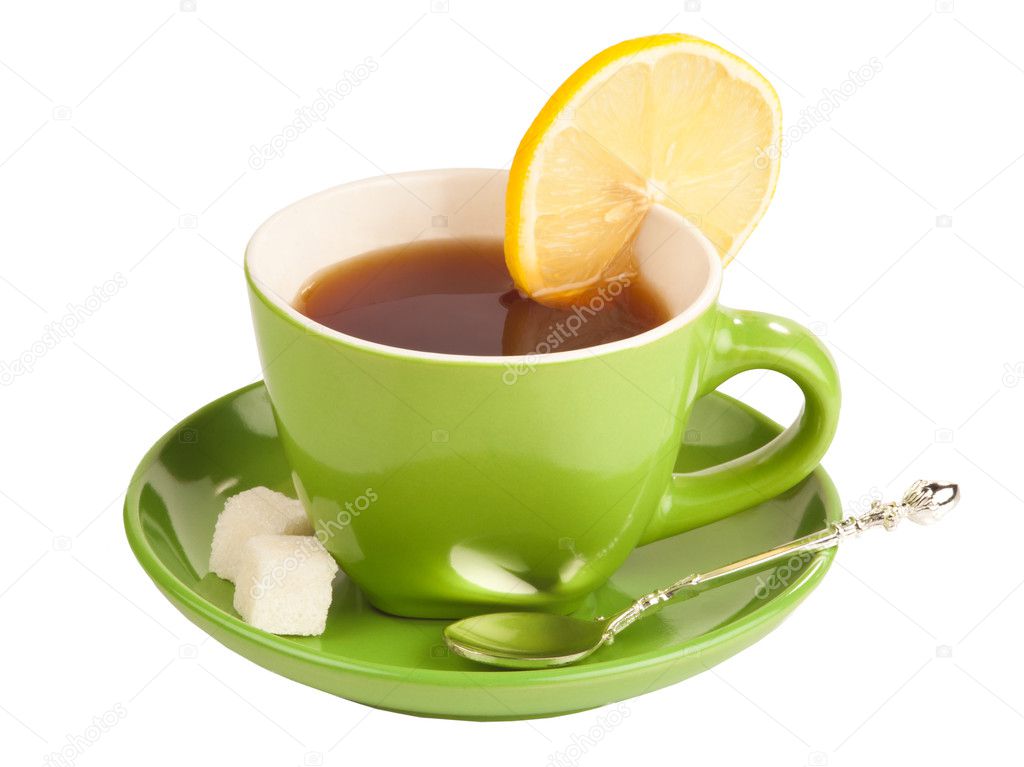 Green teacup with sugar and lemon.