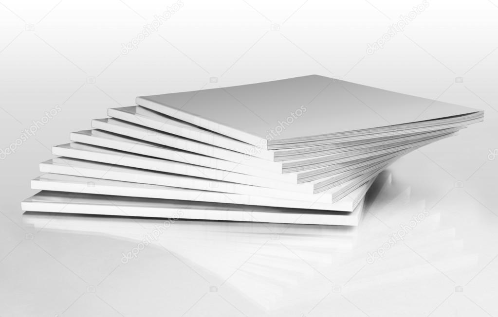 Stack of magazines with a blank cover