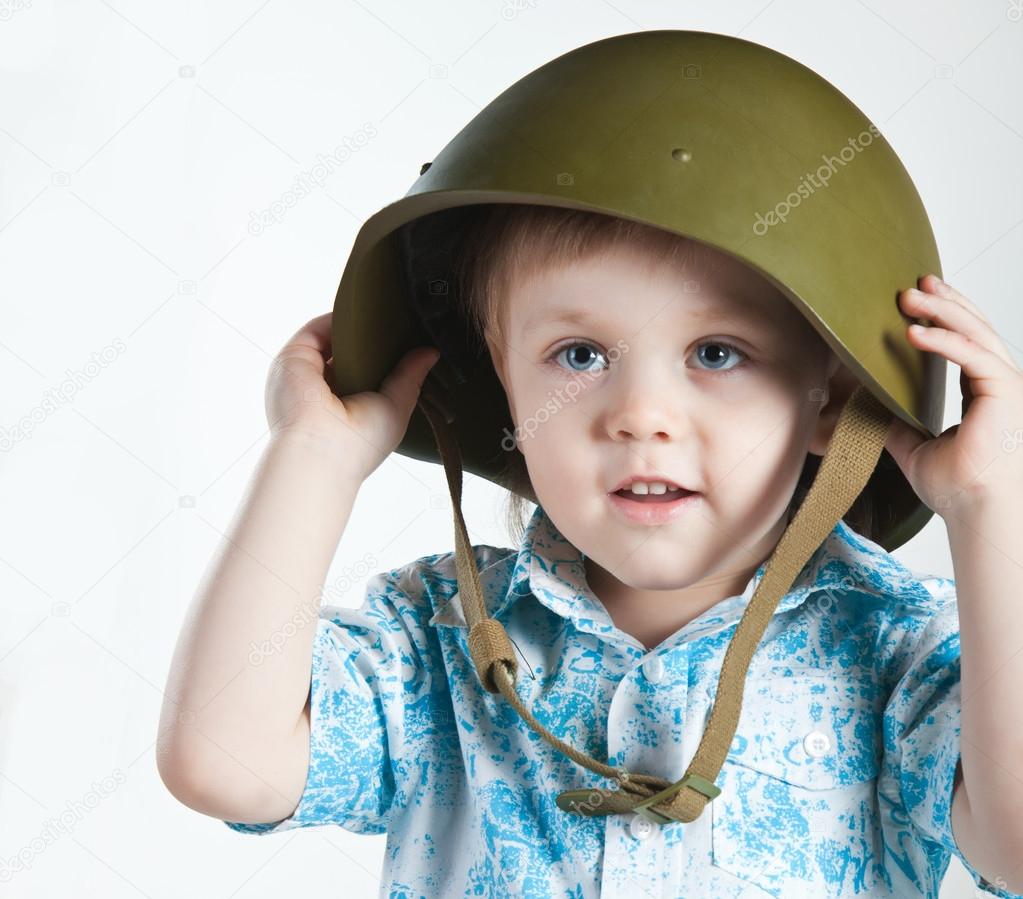 Boy with army helmet