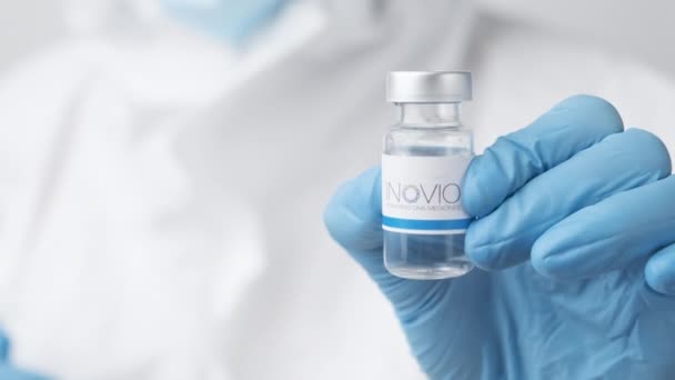 Inovio Vial Bottle Pharmaceuticals Demonstrated Health Worker Scientist Rubber Gloves — Stock Video