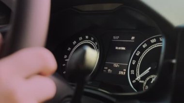 Green arrow indicates left turn flashing on car dashboard