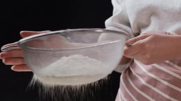 Baker sifts flour through sieve for baking homemade bread — стокове відео
