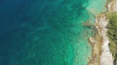 Aerial view of rocky coast of the Adriatic sea with crystal clear waters