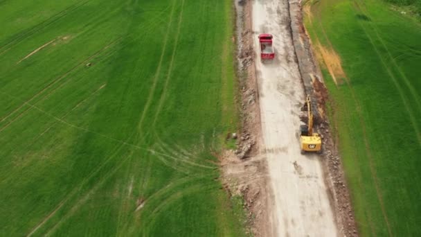 Tatra red truck transports soil from the field along a dirt road, October 2021, Prague, Czech Republic — Wideo stockowe