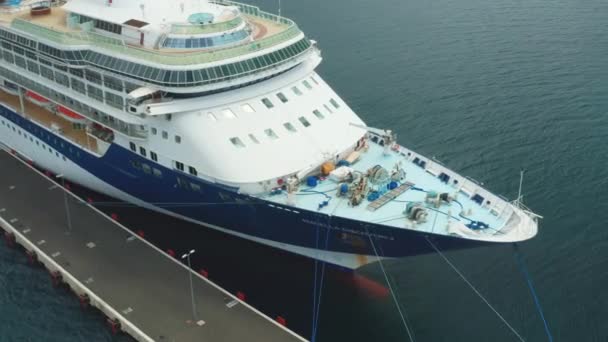 Aerial footage of the stern of the touristic cruise ship moored in marina. Camera turns around the deck, October 2021, Zadar, Croatia — Wideo stockowe
