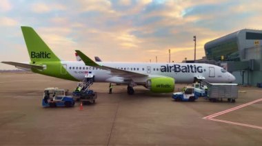 Suitcases are loaded onto the plane airBaltic, December 2021, Kyiv, Ukraine
