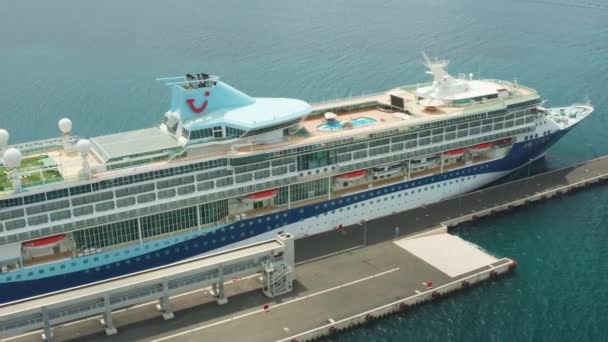 Flying along a luxury cruise ship or linear with a swimming pool on the roof moored in marina, October 2021, Zadar, Croatia — 비디오