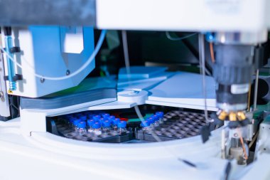 Auto sample with glass vials and blue caps for HPLC analysis of the biological samples. Research of oncological diseases