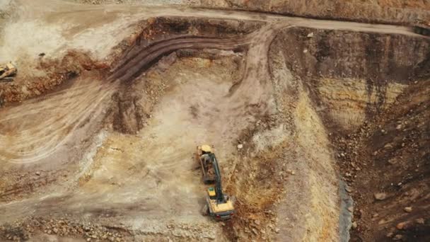 Aerial view of Volvo excavator loading soil into the truck in the quarry, January 2022, Prague, Czech Republic — Stock Video