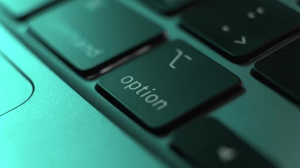 Man hand fingers press button Option on the black keyboard — стоковое видео