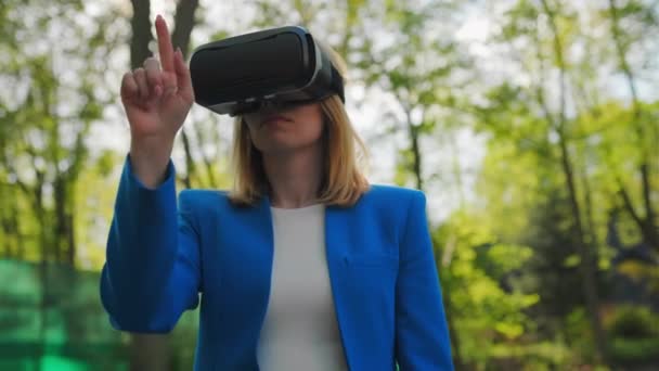 Business Woman Controls Virtual Interface Pressing Buttons Her Finger Goggles — Stockvideo