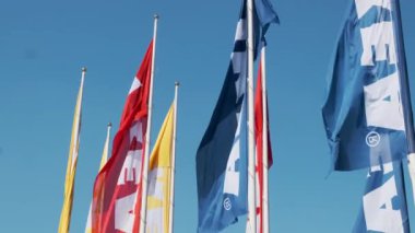 Colorful IKEA flags waving the wind against sky, July 2022, Prague, Czech Republic.