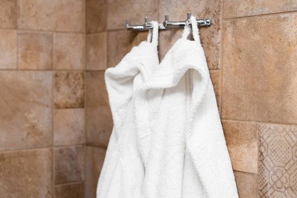 Fresh White Bathrobes Hanging Hooks Bathroom Hotel Room — Foto de Stock