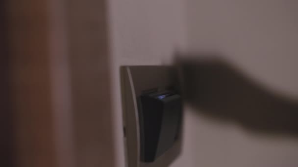Female Person Hand Puts Back Key Card Room Card Holder — стоковое видео