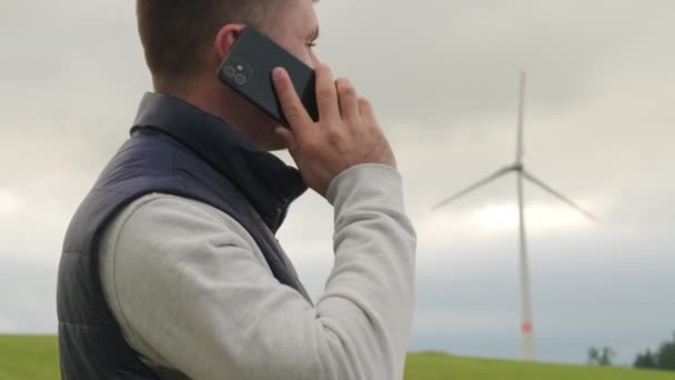 Man Researcher Reports Functioning Wind Turbine Smartphone Looking Windmill Wind — Vídeos de Stock