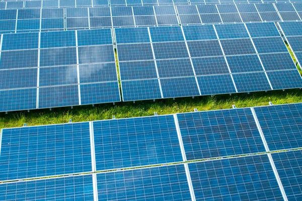 Solar panels in the green field for generation of green energy safety for environmental