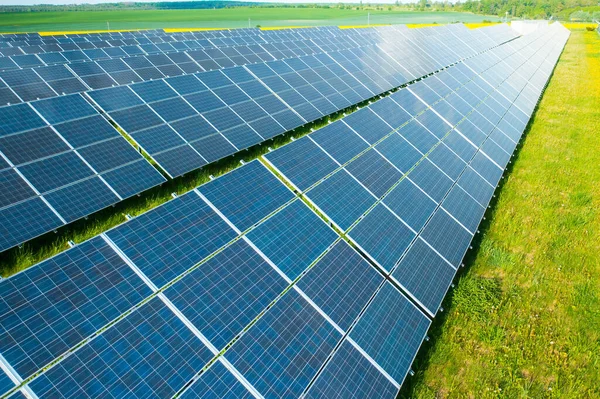 Solar panels in the green field for generation of green energy safety for environmental