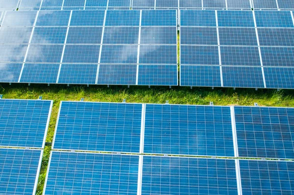 Solar panels in the green field for generation of green energy safety for environmental