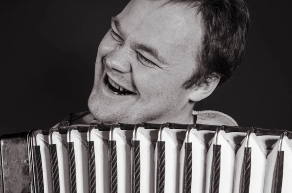 Russian poor man with an accordion — Stock Photo, Image