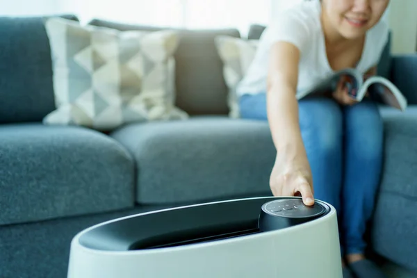 Happy Asian Young Woman Turning High Efficiency Air Purifier While — Stock fotografie