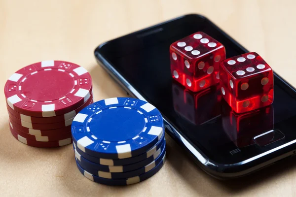 Mobile phone, Poker Chips and Dices — Stock Photo, Image