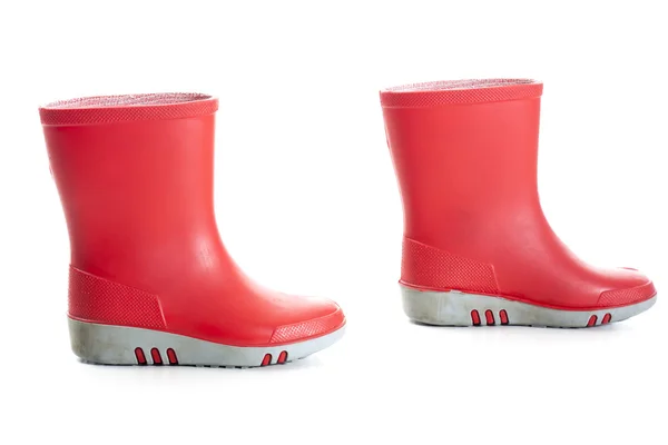 Crianças vermelhas botas de chuva — Fotografia de Stock