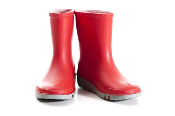 Crianças vermelhas botas de chuva — Fotografia de Stock