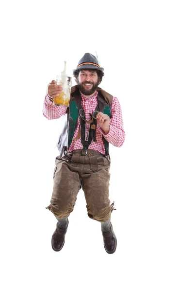 Bearded, bavarian guy jumping with wheat beer — Stock Photo, Image
