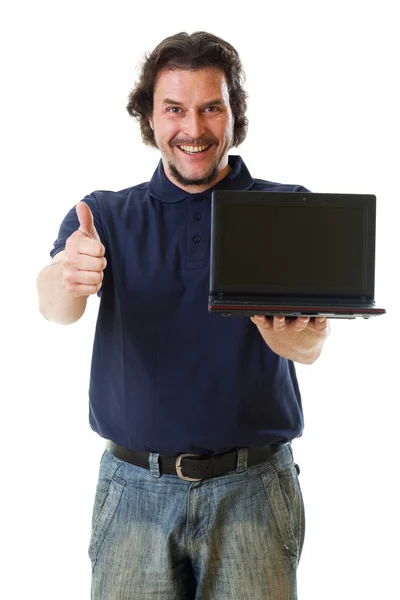 Mid-aged man in blue shirt with netbook showing thumbs up Stock Photo