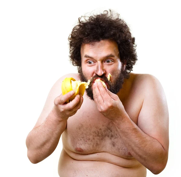 Wild guy eating a banana — Stock Photo, Image