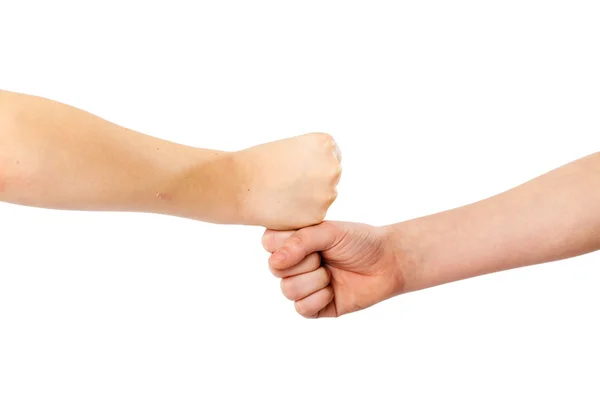 Two kids' fists lying on each other, isolated white — Stock Photo, Image