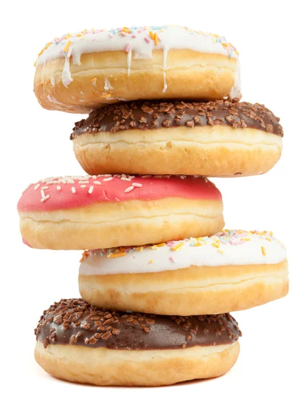 Pilha de donuts brancos, vermelhos e castanhos — Fotografia de Stock