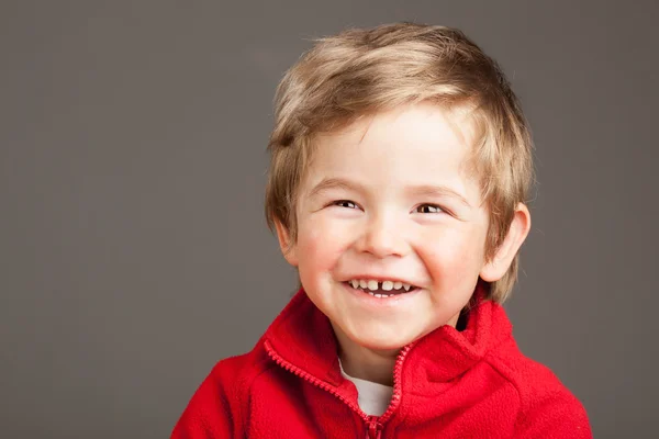 Portrait of laughing blonde toddler boy on white — Stock Photo, Image
