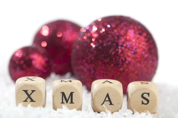 Christmas decoration balls and Xmas text — Stock Photo, Image