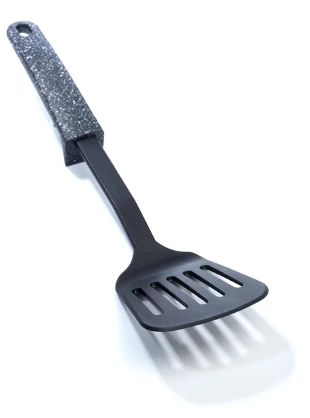 Kitchen utensils: Plastic fish slice — Stock Photo, Image