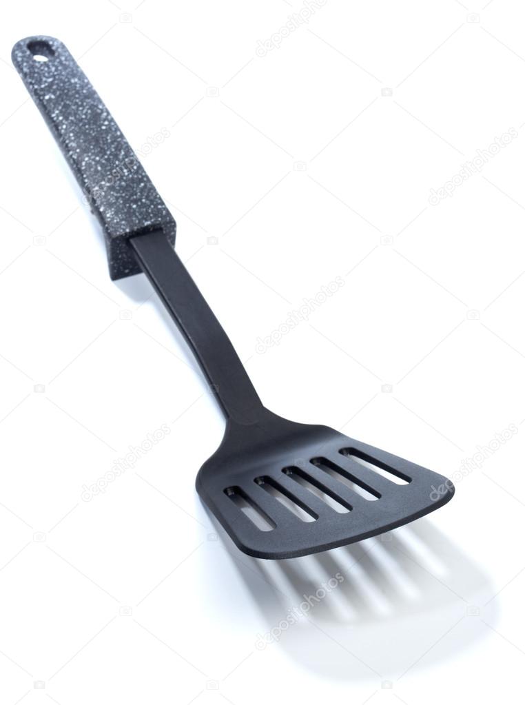 Kitchen utensils: Plastic fish slice Stock Photo by