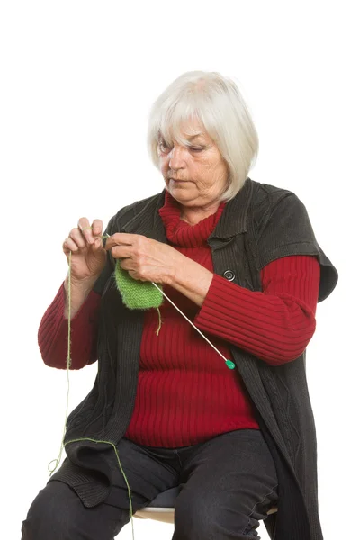 Senior Caucasian woman knitting — Stock Photo, Image