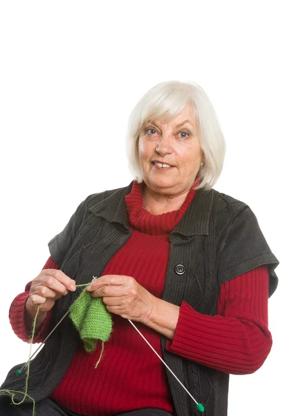 Senior Caucasian woman knitting — Stock Photo, Image