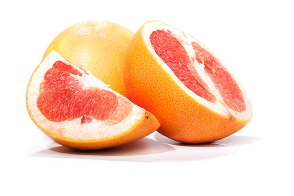 Grapefruit, pieces cut apart, isolated on white — Stock Photo, Image