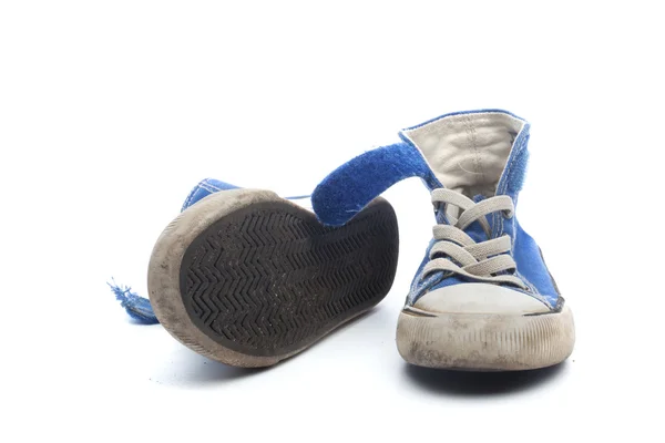Pair of dirty, worn out blue children sneakers — Stock Photo, Image