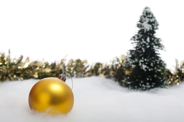 Christmas bauble with fir tree and garland — Stock Photo, Image