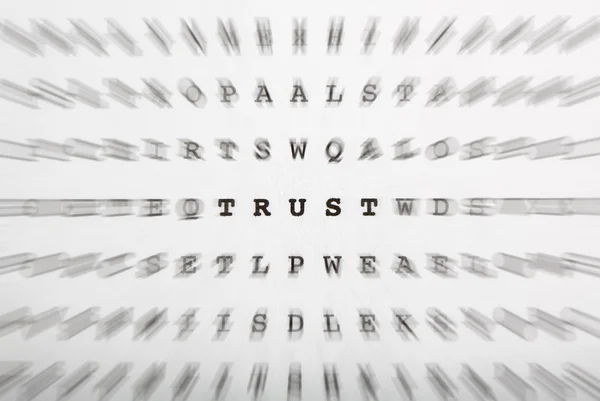 Crossword letters, focus on word trust — Stock Photo, Image