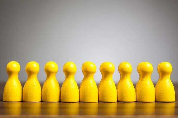 Concepto de figura de peón de juguete: Fuerza, éxito a través del trabajo en equipo — Foto de Stock